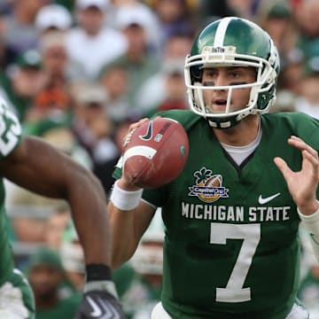 Jan 1, 2009; Orlando, FL, USA; Michigan State Spartans quarterback Brian Hoyer (7) scrambles out of the pocket against the Georgia Bulldogs at Florida Citrus Bowl Stadium. Mandatory Credit: Matthew Emmons-Imagn Images