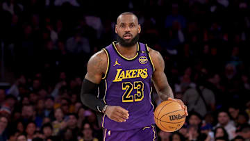 Feb 1, 2025; New York, New York, USA; Los Angeles Lakers forward LeBron James (23) brings the ball up court against the New York Knicks during the third quarter at Madison Square Garden. Mandatory Credit: Brad Penner-Imagn Images