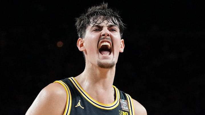 Michigan Wolverines center Aday Mara (15) reacts against the Arizona Wildcats during the Final Four of the 2026 NCAA Tournament at Lucas Oil Stadium on April 4, 2026.