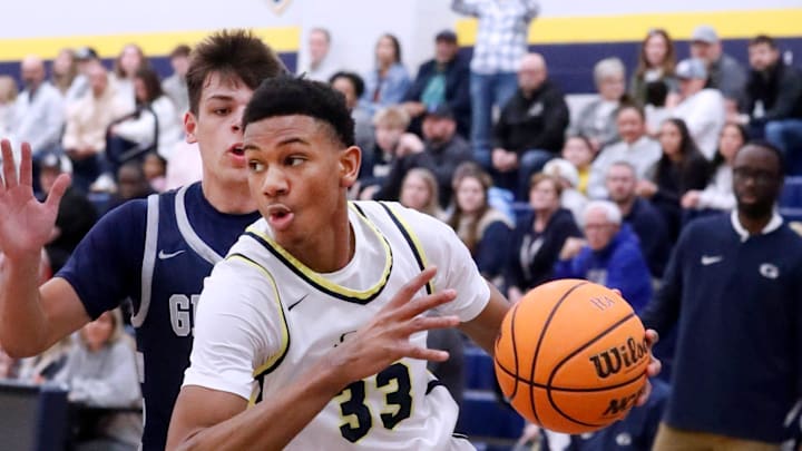 PCA’s Chris Washington Jr (33) drives to the basket around Grace Christian Academy's Cameron Mercer (0) during the Division II-A state quarterfinals boys’ basketball game on Saturday, March 1, 2025, at PCA.
