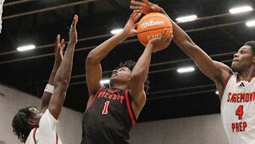 Victory’s #1 Jozia Scott shot is blocked by Sagemont’s #4 Kevin Thomas as teammate Patrick Liburd blocks the lane, 1A Championship game. Lakeland’s Victory Christian HS vs Weston’s Sagemont HS FHSAA 1A State Boys basketball Championship game at the RP Funding Center in Lakeland Fl. February 27th 2025. Photos special to the Ledger / Calvin Knight