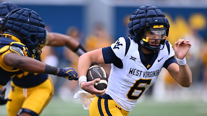WVU quarterback Max Brown rushes the ball during the 2025 Gold-Blue Spring Showcase.