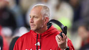 Nov 21, 2024; Atlanta, Georgia, USA; North Carolina State Wolfpack head coach Dave Doeren talks to a referee against the Georgia Tech Yellow Jackets in the fourth quarter at Bobby Dodd Stadium at Hyundai Field. Mandatory Credit: Brett Davis-Imagn Images