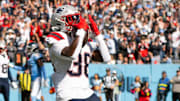 Oct 19, 2025; Nashville, Tennessee, USA;  New England Patriots running back Rhamondre Stevenson (38) celebrates with his teammates after touchdown against the Tennessee Titans during the second half at Nissan Stadium. Mandatory Credit: Steve Roberts-Imagn Images