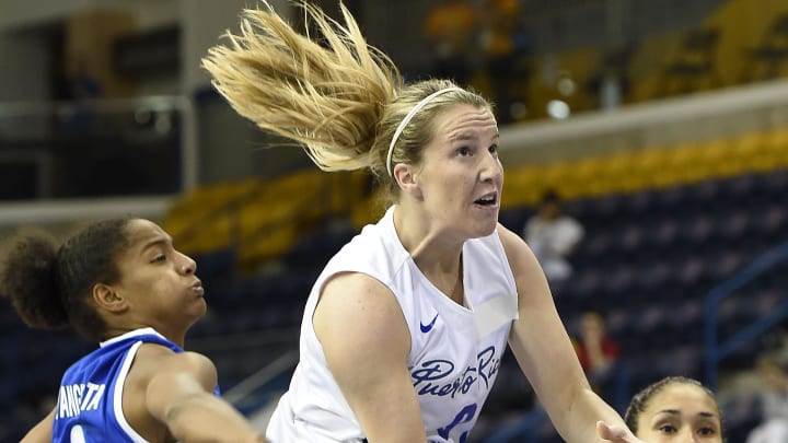 Jul 16, 2015; Toronto, Ontario, CAN; Puerto Rico guard Allison Gibson (9) shoots the ball agisnt Dominican Republic center Danilsa Andujar (14) and Dominican Republic guard Genesis Martinez (9) in the women's basketball preliminary round during the 2015 Pan Am Games at Ryerson Athletic Centre. Mandatory Credit: John David Mercer-USA TODAY Sports