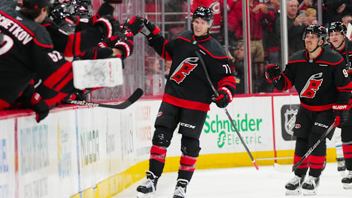 Mar 9, 2025; Raleigh, North Carolina, USA;  Carolina Hurricanes center Mark Jankowski (77) celebrates his goal against the Winnipeg Jets during the second period at Lenovo Center. Mandatory Credit: James Guillory-Imagn Images