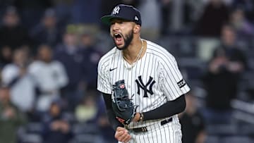 Apr 15, 2025; Bronx, New York, USA;  New York Yankees relief pitcher Devin Williams (38) celebrates after recording a save in a 4-2 win against the Kansas City Royals at Yankee Stadium. All players wore #42 for Jackie Robinson Day.  Mandatory Credit: Wendell Cruz-Imagn Images