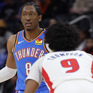 Jan 28, 2024; Detroit, Michigan, USA; Oklahoma City Thunder forward Jalen Williams (8) dribbles defended by Detroit Pistons forward Ausar Thompson (9) in the first half at Little Caesars Arena. Mandatory Credit: Rick Osentoski-Imagn Images