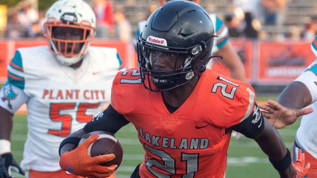 Lakeland wide receiver Cam Fuse runs after a reception against Plant City on Friday night at Bryant Stadium.