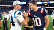 Aug 8, 2024; Foxborough, Massachusetts, USA; New England Patriots quarterback Drake Maye (10) high-fives Carolina Panthers long snapper JJ Jansen (44) after a game at Gillette Stadium.