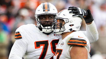 Oct 15, 2023; Cleveland, Ohio, USA; Cleveland Browns offensive tackle Dawand Jones (79) hugs guard Wyatt Teller (77) as they celebrate the team   s win against the San Francisco 49ers during the fourth quarter at Cleveland Browns Stadium. Mandatory Credit: Scott Galvin-Imagn Images