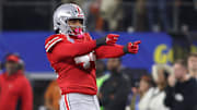 Jan 10, 2025; Arlington, Texas, USA; Ohio State Buckeyes defensive end JT Tuimoloau (44) celebrates after a play during the first quarter of the College Football Playoff semifinal against the Texas Longhorns in the Cotton Bowl at AT&T Stadium. Mandatory Credit: Tim Heitman-Imagn Images