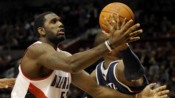 Nov. 3, 2009; Portland, OR, USA; Portland Trailblazers center Greg Oden grabs a rebound away from Atlanta Hawks forward Josh Smith (5) in the first quarter of the game at the Rose Garden. Mandatory Credit: Steve Dykes-Imagn Images