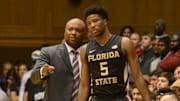 Feb 25, 2016; Durham, NC, USA; Florida State Seminoles head coach Leonard Hamilton (left) talks to guard Malik Beasley (5) during the second half against the Duke Blue Devils at Cameron Indoor Stadium. Duke won 80-65. Mandatory Credit: Rob Kinnan-Imagn Images