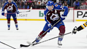 Mar 4, 2025; Denver, Colorado, USA; Colorado Avalanche center Nathan MacKinnon (29) controls the puck in the second period against the Pittsburgh Penguins at Ball Arena. Mandatory Credit: Ron Chenoy-Imagn Images