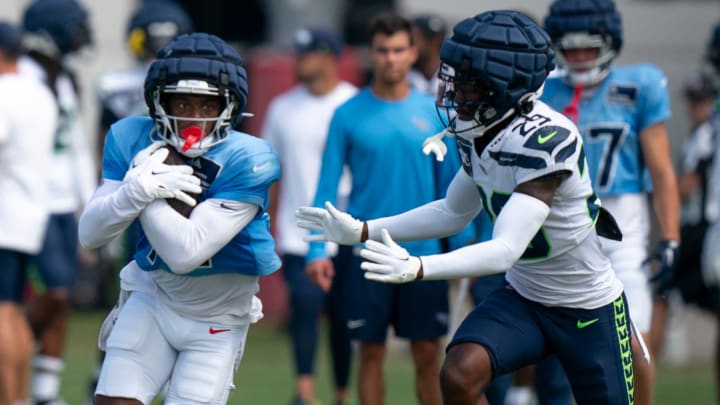 Tennessee Titans wide receiver Jha'Quan Jackson (19) runs after a catch against Seattle Seahawks cornerback D.J. James (29) at Ascension Saint Thomas Sports Park in Nashville, Tenn., Wednesday, Aug. 14 2024. This is the first day of the Titans joint practice with the Seattle Seahawks.