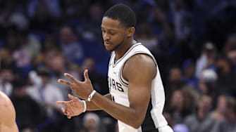 Dec 3, 2025; Orlando, Florida, USA; San Antonio Spurs guard De'Aaron Fox (4) reacts after a three point basket against the Orlando Magic in the fourth quarter at Kia Center.