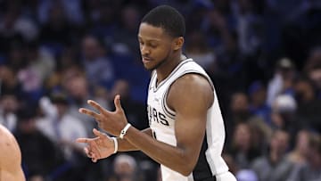 Dec 3, 2025; Orlando, Florida, USA; San Antonio Spurs guard De'Aaron Fox (4) reacts after a three point basket against the Orlando Magic in the fourth quarter at Kia Center.