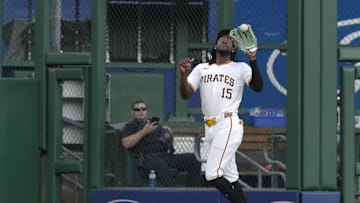 Sep 5, 2024; Pittsburgh, Pennsylvania, USA;  Pittsburgh Pirates center fielder Oneil Cruz (15) catches a ball hit by first baseman Juan Yepez (not pictured) for the third out of the second inning at PNC Park. Mandatory Credit: Charles LeClaire-Imagn Images