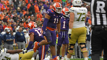 Nov 11, 2023; Clemson, South Carolina, USA; Clemson Tigers defensive lineman Peter Woods (11) reacts after tackling Georgia Tech Yellow Jackets quarterback Haynes King (10) during the third quarter at Memorial Stadium. Mandatory Credit: Ken Ruinard-Imagn Images