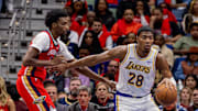 Nov 14, 2025; New Orleans, Louisiana, USA;  Los Angeles Lakers forward Rui Hachimura (28) dribbles against New Orleans Pelicans forward Herbert Jones (2) during the second half at Smoothie King Center. Mandatory Credit: Stephen Lew-Imagn Images