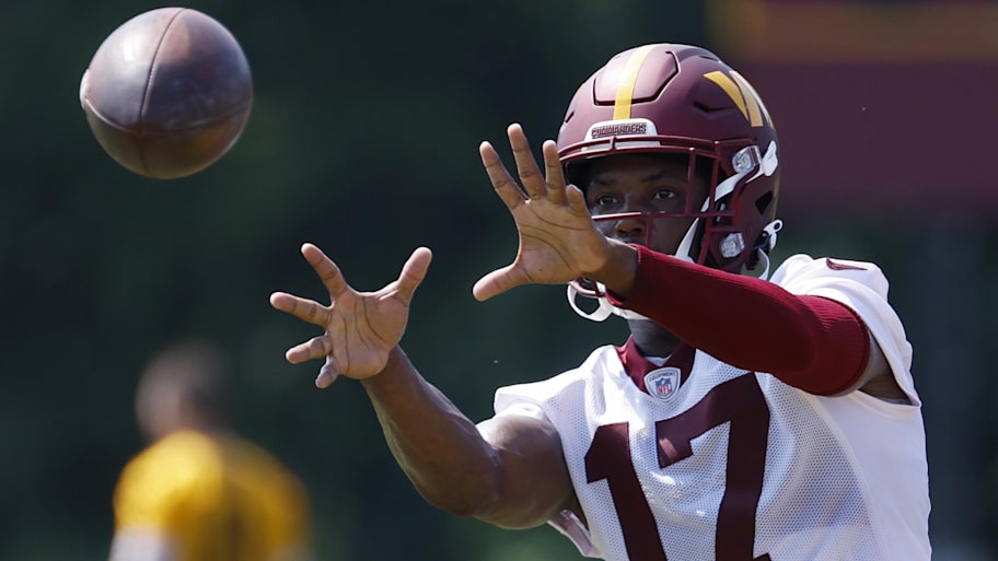 Jul 28, 2023; Ashburn, VA, USA; Washington Commanders wide receiver Terry McLaurin (17) catches a ball after morning practice on day three of Commanders training camp at OrthoVirginia Training Center. Mandatory Credit: Geoff Burke-Imagn Images | Geoff Burke-Imagn Images