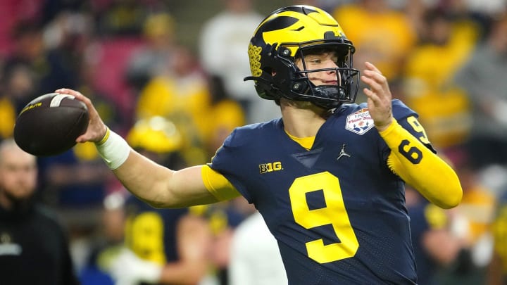 December 31, 2022; Glendale, Ariz; USA; Michigan quarterback JJ McCarthy (9) throws a pass during the pregame before the Fiesta Bowl at State Farm Stadium