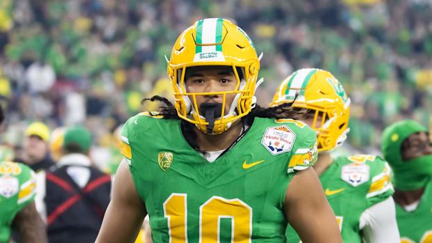 regon Ducks defensive end Matayo Uiagalelei (10) against the Liberty Flames during the 2024 Fiesta Bowl at State Farm Stadium