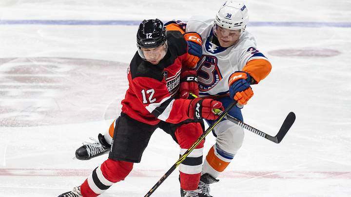 Utica's Andre Ghantous battles with Bridgeport's Alex Jefferies at the Adirondack Bank Center on Friday, March 22, 2024. Utica's Andre Ghantous battles with Bridgeport's Alex Jefferies at the Adirondack Bank Center on Friday, March 22, 2024.