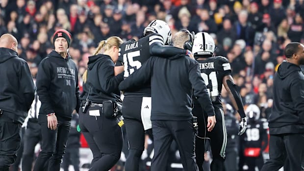 Nebraska quarterback Dylan Raiola is helped off the field after suffering an injury against USC.