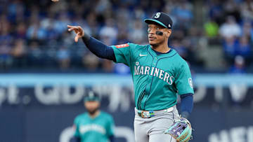 Oct 13, 2025; Toronto, Ontario, CAN; Seattle Mariners infielder Jorge Polanco (7) throws to first base for the first out in the third inning against the Toronto Blue Jays during game two of the ALCS round for the 2025 MLB playoffs at Rogers Centre. Mandatory Credit: Nick Turchiaro-Imagn Images