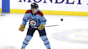 Apr 1, 2024; Winnipeg, Manitoba, CAN; Winnipeg Jets center Cole Perfetti (91) puck juggle before a game against the Los Angeles Kings at Canada Life Centre. Mandatory Credit: James Carey Lauder-USA TODAY Sports
