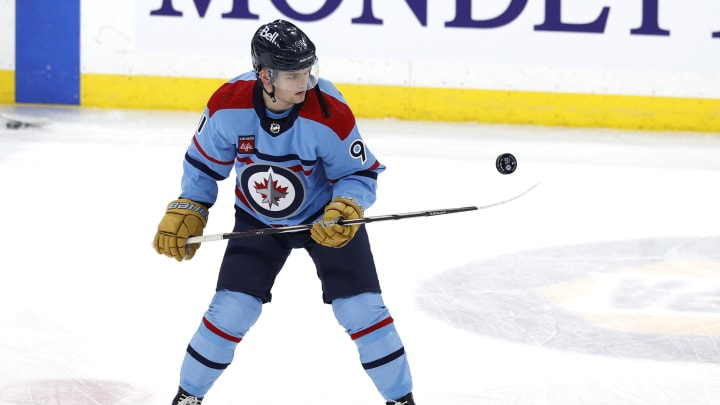 Apr 1, 2024; Winnipeg, Manitoba, CAN; Winnipeg Jets center Cole Perfetti (91) puck juggle before a game against the Los Angeles Kings at Canada Life Centre. Mandatory Credit: James Carey Lauder-USA TODAY Sports