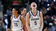 Mar 26, 2022; Bridgeport, CT, USA; UConn Huskies guard Paige Bueckers (5) and guard Azzi Fudd (35) react after a play against the Indiana Hoosiers during the second half in the Bridgeport regional semifinals of the women's college basketball NCAA Tournament at Webster Bank Arena. Mandatory Credit: David Butler II-Imagn Images