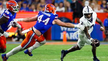Florida Gators edge Jack Pyburn (44) chases down Samford Bulldogs quarterback Quincy Crittendon (2) during the first half at Ben Hill Griffin Stadium in Gainesville, FL on Saturday, September 7, 2024 against the Samford Bulldogs. The Gators lead 14-0 at the half. [Doug Engle/Gainesville Sun]