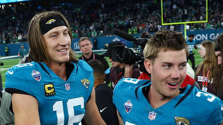 American Football - NFL - Philadelphia Eagles v Jacksonville Jaguars - Tottenham Hotspur Stadium, London, Britain - October 11, 2026 Jacksonville Jaguars' Trevor Lawrence and Cam Little celebrate after the game Action Images via Reuters/Peter Cziborra