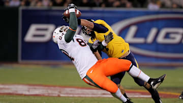 Dec. 27, 2008; San Francisco, CA, USA; California Golden Bears linebacker Anthony Felder (right) fights for the ball with tight end Richard Gordon (84) during the first quarter in the 2008 Emerald Bowl at AT&T Park in San Francisco, CA. Mandatory Credit: Phil Carter-Imagn Images