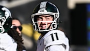 Nov 22, 2025; Iowa City, Iowa, USA; Michigan State Spartans quarterback Alessio Milivojevic (11) warms up before the game against the Iowa Hawkeyes at Kinnick Stadium. Mandatory Credit: Jeffrey Becker-Imagn Images