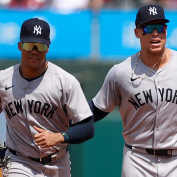 Jul 31, 2024; Philadelphia, Pennsylvania, USA;  New York Yankees outfielder Aaron Judge (R) and outfielder Juan Soto (L) run from the outfield.