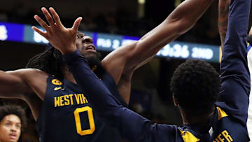 Nov 15, 2024; Pittsburgh, Pennsylvania, USA;  Pittsburgh Panthers guard Damian Dunn (1) shoots against West Virginia Mountaineers center Eduardo Andre (0) and guard KJ Tenner (3) during the second half at the Petersen Events Center. Mandatory Credit: Charles LeClaire-Imagn Images