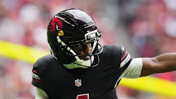 Arizona Cardinals receiver Greg Dortch (4) tries to stiff arm San Francisco 49ers linebacker Dee Winters (53) at State Farm Stadium in Glendale on Nov. 16, 2025.