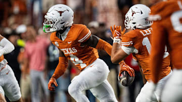 Oct 19, 2024; Austin, Texas, USA; Texas Longhorns defensive back Andrew Mukuba (4) runs across the field with the ball after an interception against the Georgia Bulldogs in the first quarter at Darrell K. Royal Texas Memorial Stadium. Mandatory Credit: Sara Diggins/USA TODAY Network via Imagn Images