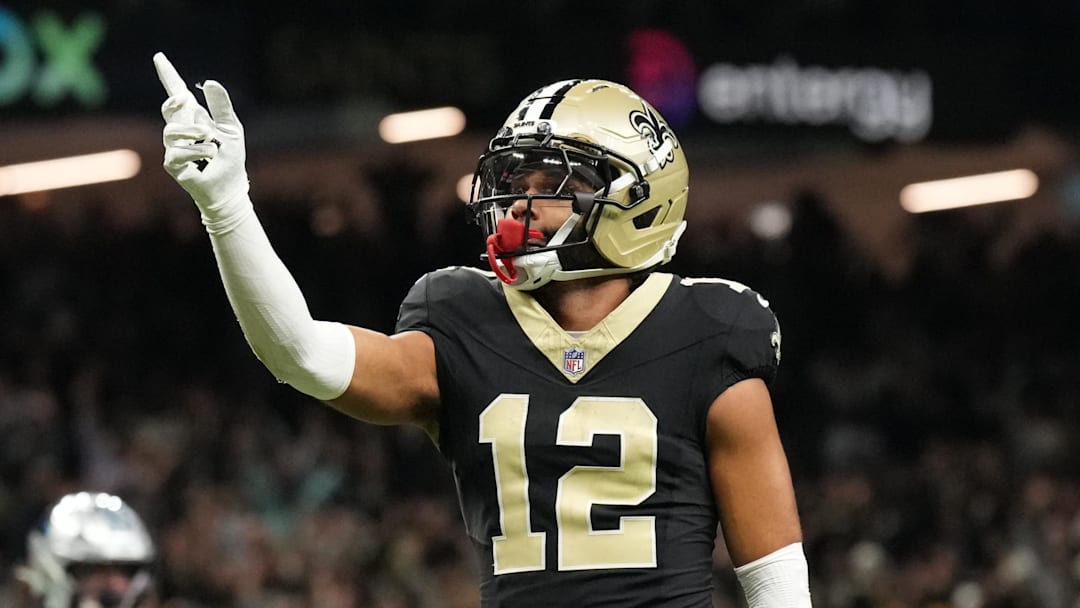 Dec 14, 2025; New Orleans, Louisiana, USA; New Orleans Saints wide receiver Chris Olave (12) reacts after scoring a touchdown in the fourth quarter against the Carolina Panthers at Caesars Superdome. Mandatory Credit: Matthew Hinton-Imagn Images