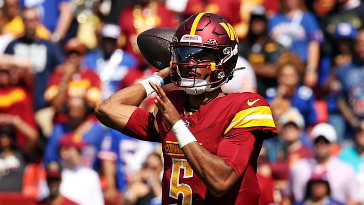 Sep 15, 2024; Landover, Maryland, USA; Washington Commanders quarterback Jayden Daniels (5) throws a pass during the first quarter against the New York Giants at Commanders Field. Mandatory Credit: Peter Casey-Imagn Images