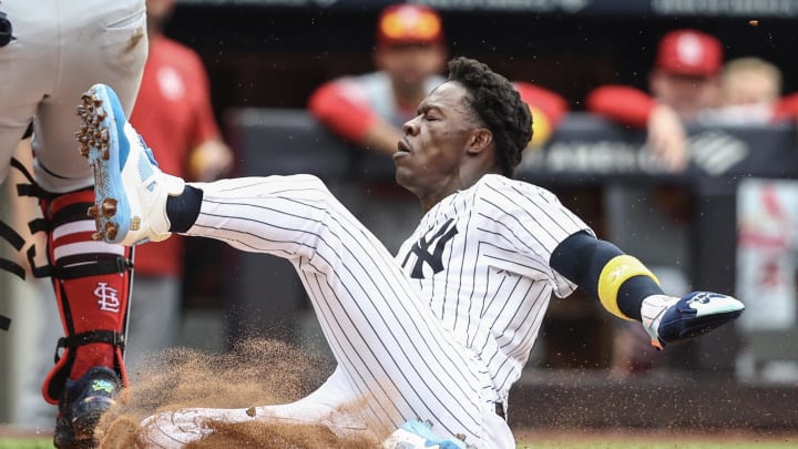 New York Yankees third baseman Jazz Chisholm Jr. (13) slides safely into home plate in the second inning against the St. Louis Cardinals at Yankee Stadium on Sept 1.