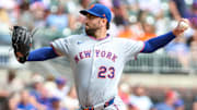 Aug 24, 2025; Cumberland, Georgia, USA; New York Mets pitcher David Peterson (23) pitches the ball against the Atlanta Braves during the third inning at Truist Park. Mandatory Credit: Jordan Godfree-Imagn Images
