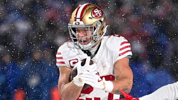 Dec 1, 2024; Orchard Park, New York, USA; San Francisco 49ers running back Christian McCaffrey (23) carries the ball against the Buffalo Bills in the second quarter at Highmark Stadium. Mandatory Credit: Mark Konezny-Imagn Images