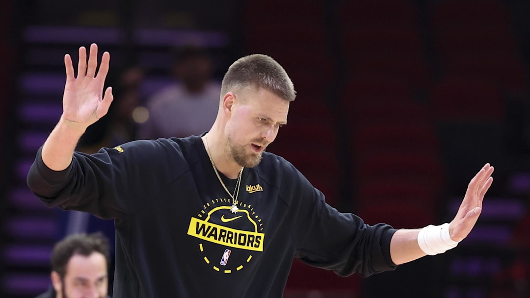 Mar 5, 2026; Houston, Texas, USA; Golden State Warriors center Kristaps Porzingis (7) reacts while warming up before the game against the Houston Rockets at Toyota Center. Mandatory Credit: Troy Taormina-Imagn Images