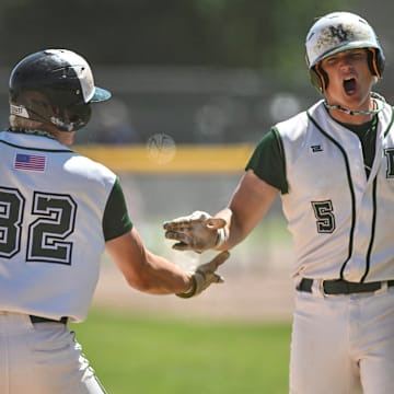 Dylan Jacobs smashes a two-run home run in the sixth inning of Mount Vernon's 14-6 win over Kennewick to capture WIAA Class 3A baseball title.