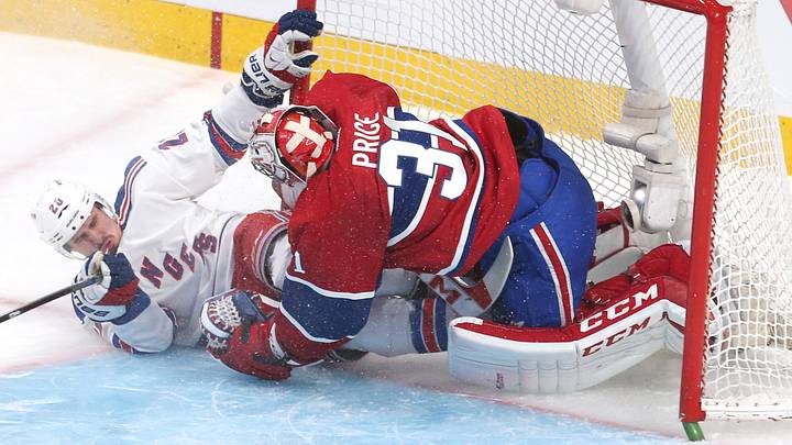 May 17, 2014; Montreal, Quebec, CAN; New York Rangers left wing Chris Kreider (20) crashes into Montreal Canadiens goalie Carey Price (31) during the second period in game one of the Eastern Conference Finals of the 2014 Stanley Cup Playoffs at Bell Centre. Mandatory Credit: Jean-Yves Ahern-USA TODAY Sports